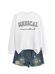 Detail of Medical Assistant sweatshirt with side slits and distressed denim shorts texture