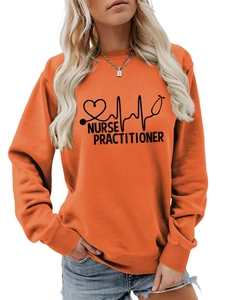 Close-up of the orange sweatshirt's heart stethoscope print and Nurse Practitioner text