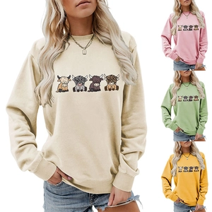 Women's crewneck sweatshirts featuring four cartoon highland cows in multiple colors