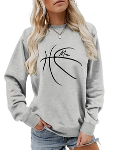 Close-up of the MOM basketball line art print on a light gray long sleeve sweatshirt