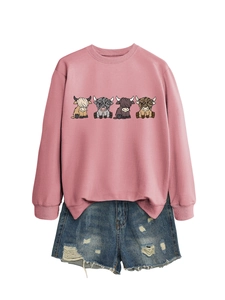 Pink long sleeve sweatshirt with highland cow prints and distressed denim shorts