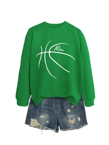 Flat lay of a green long sleeve mom basketball sweatshirt and ripped denim shorts set
