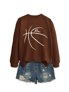 Flat lay of brown Mom basketball sweatshirt paired with distressed blue denim shorts