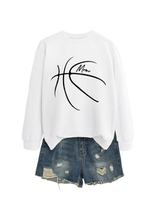 Detail of white long sleeve sweatshirt with Mom basketball graphic and distressed denim shorts
