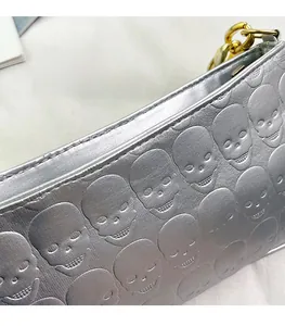 Detail of retro skull embossed silver chain bag with high-quality precision stitching