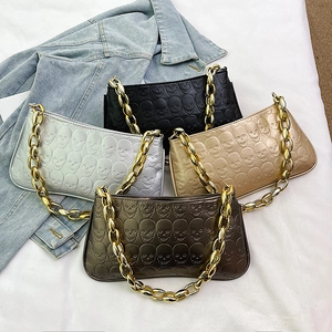 Vintage embossed skull pattern handbags with thick metal chain straps in four colors