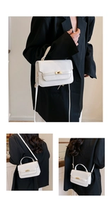 Detail of white square bag showing gold metal lock and various carrying styles on model
