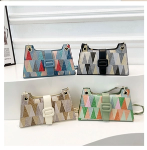 Detailed view of colorful geometric triangle patterns on stylish shoulder bags
