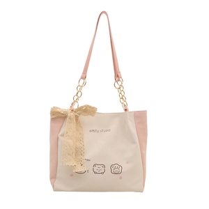 Minimalist tote bag with pink straps and cute cartoon prints plus a decorative lace bow