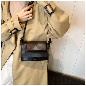 Detail of grey plaid crossbody bag with knot strap and Fashion & Bags text on model