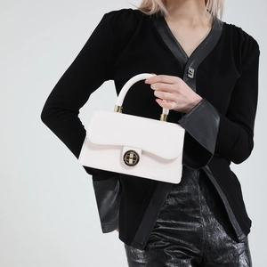Structured beige oil wax leather handbag with golden lock and top handle for women