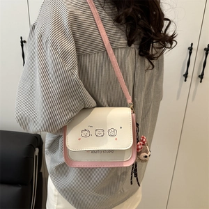 Pink and white stylish crossbody bag with cute bear prints and plush pendant charm