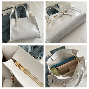 Detail of white PU tote bag showing bow decoration, gold zipper, and large capacity interior