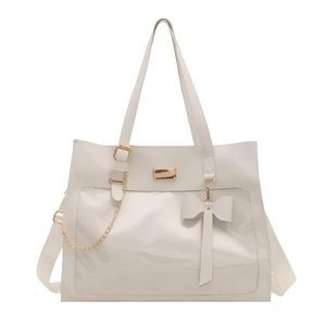 White ribbon tote bag with transparent display window and gold chain bow detail