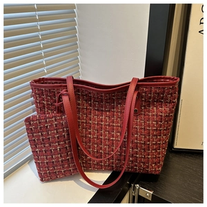 Detail of red tweed tote bag with gold thread weave and matching small pouch set