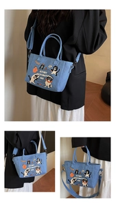 Detail view of denim tote bag with cute animal prints and adjustable shoulder straps