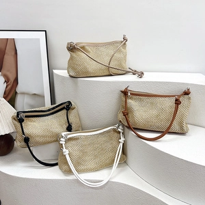Minimalist woven straw hobo bags with contrasting leather straps in four neutral colors