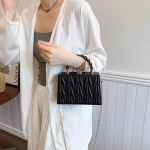 Fashionable black geometric textured crossbody box bag with gold chain and woven handle
