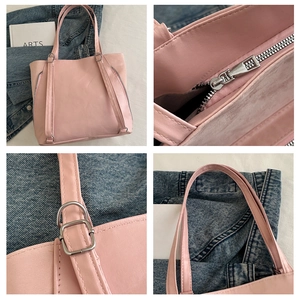 Detail view of pink PU tote showing decorative zippers, silver hardware, and fine stitching