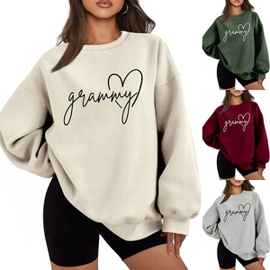 Close-up of the heart and grammy print on a stylish oversized crewneck sweatshirt