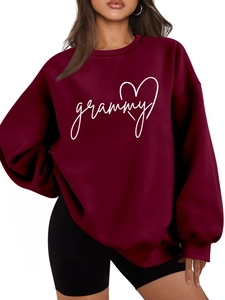 Close-up of burgundy cotton sweatshirt with white grammy text and heart pattern