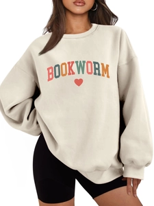 Close-up of beige fleece Bookworm sweatshirt featuring colorful letters and red heart
