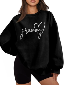 Detail of grammy heart print on oversized black long-sleeved crewneck sweatshirt