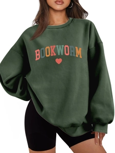 Detail of oversized dark green sweatshirt showing Bookworm text and heart embroidery