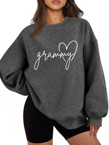 Detail of loose dark grey sweatshirt with grammy heart print and soft cotton fabric