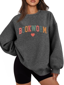 Detail of colorful BOOKWORM letter embroidery and heart on a dark grey sweatshirt