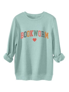 Detail of Bookworm print and red heart on light sage green fleece sweatshirt