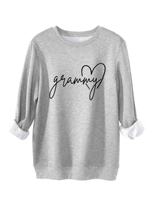Detail of light gray sweatshirt showing warm white fleece lining and grammy heart embroidery