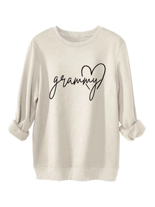 Detail of cream sweatshirt with grammy text and heart graphic on soft knit fabric