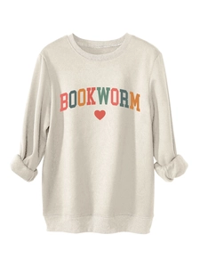 Detail of colorful BOOKWORM lettering and red heart on beige fleece sweatshirt