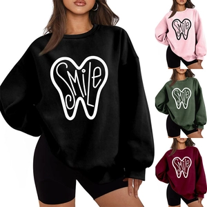 Detail view of the smile print on thick fleece sweatshirts in four available colors