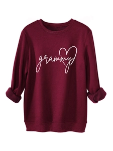 Detail of burgundy sweatshirt featuring white grammy heart print and ribbed cuffs