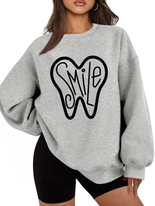 Close-up of smile tooth print on gray long sleeve crewneck sweatshirt for women