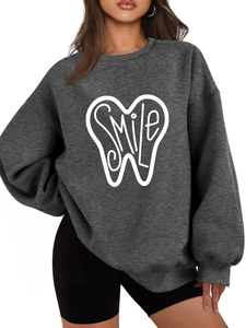 Detail of SMILE lettering print and high-quality dark grey cotton fabric on hoodie