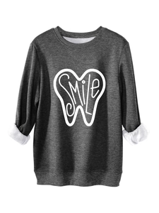 Detailed view of dark grey sweatshirt featuring white smile print and soft fleece lining