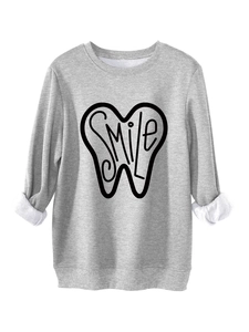 Detail of grey fleece sweatshirt showing warm white lining and SMILE tooth graphic