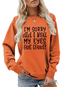 Detail of orange crewneck sweatshirt featuring black I'M SORRY slogan print for women