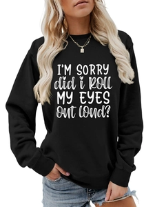 Close-up of white graphic text print on a black long-sleeve casual sweatshirt