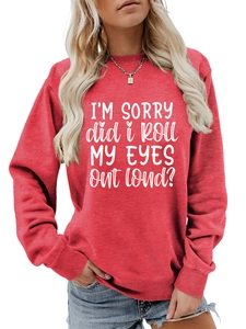 Detail of red crewneck sweatshirt with ribbed cuffs and white slogan print