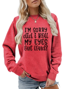 Detail of red crewneck sweatshirt with 'I'M SORRY' text print and ribbed cuffs