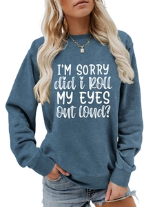 Detail of blue crewneck sweatshirt with I'M SORRY white slogan print and gold necklace