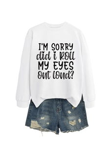 Flat lay of white long sleeve sweatshirt with black letter print and denim shorts