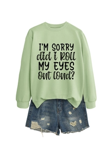 Flat lay of green sweatshirt with I'm sorry did I roll my eyes out loud text and denim shorts