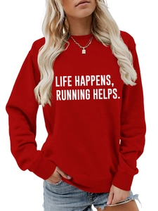 Detail of red crewneck sweatshirt with Life Happens Running Helps slogan and ribbed cuffs