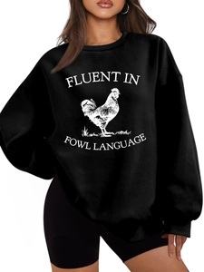 Close-up of black crewneck sweatshirt with white rooster print and funny quote