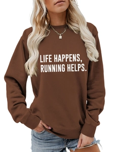 Detail of coffee brown sweatshirt fabric featuring white Life Happens Running printed text